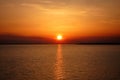 Beautiful sunset over the calm sea water with reflection of the sun. Orange color, sky landscape for wallpaper, background Royalty Free Stock Photo