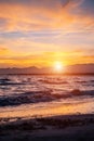 beautiful sunset over calm sea, waves of water and clean sand, Salou, Spain Royalty Free Stock Photo