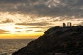 Beautiful sunset over the cliff of The Temple of Poseidon at Cape Sounion, over the Aegean Sea Greece Royalty Free Stock Photo