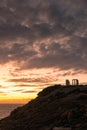 Beautiful sunset over the cliff of The Temple of Poseidon at Cape Sounion, over the Aegean Sea Greece Royalty Free Stock Photo