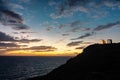 Beautiful sunset over the cliff of The Temple of Poseidon at Cape Sounion, over the Aegean Sea Greece Royalty Free Stock Photo