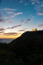 Beautiful sunset over the cliff of The Temple of Poseidon at Cape Sounion, over the Aegean Sea Greece Royalty Free Stock Photo