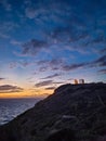 Beautiful sunset over the cliff of The Temple of Poseidon at Cape Sounion, over the Aegean Sea Greece Royalty Free Stock Photo