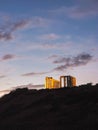 Beautiful sunset over the cliff of The Temple of Poseidon at Cape Sounion, over the Aegean Sea Greece Royalty Free Stock Photo