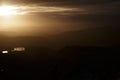Beautiful sunset over the dark blurred mountains Royalty Free Stock Photo