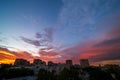 Beautiful sunset over a dark cityscape.