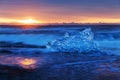 Beautiful sunset over famous Diamond beach, Iceland. This sand lava beach is full of many giant ice gems. Iceland