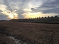 Beautiful Sunset over farm field countryside Royalty Free Stock Photo