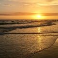 A beautiful sunset over the Gulf of Mexico is viewed from the beach at Treasure Island, Florida Royalty Free Stock Photo