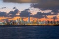 Beautiful sunset over the iconic buildings of Dubai. Amazing gray clouds and orange color sky. The modern and luxury cityscape pan