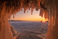 Beautiful sunset over lake Baikal look through an ice cave. Royalty Free Stock Photo