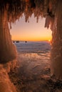 Beautiful sunset over lake Baikal look through the ice cave. Royalty Free Stock Photo