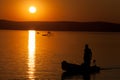 Beautiful sunset over Lake Balaton with anglers` silhouettes Royalty Free Stock Photo