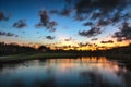 Beautiful sunset over the lake near the golf course in a tropical resort, Punta Cana Royalty Free Stock Photo