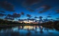 Beautiful sunset over the lake near the golf course in a tropical resort, Punta Cana Royalty Free Stock Photo