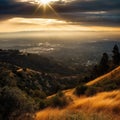 Beautiful sunset over landscape, with setting sun casting its warm glow on hills and trees. The scene is serene, as it Royalty Free Stock Photo