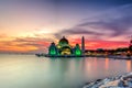 Beautiful sunset over the majestic mosque, Malacca Straits Mosque (Masjid Selat). Soft focus due to slow shutter shot. Royalty Free Stock Photo