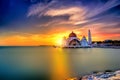 Beautiful sunset over the majestic mosque, Malacca Straits Mosque (Masjid Selat). Soft focus due to slow shutter shot. Royalty Free Stock Photo