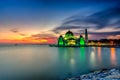 Beautiful sunset over the majestic mosque, Malacca Straits Mosque (Masjid Selat). Soft focus due to slow shutter shot. Royalty Free Stock Photo