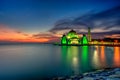 Beautiful sunset over the majestic mosque, Malacca Straits Mosque (Masjid Selat). Soft focus due to slow shutter shot. Royalty Free Stock Photo