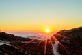 Beautiful Sunset over the Mountains of Crete Island, Greece. Panoramic View of the Horizon from the Mountain Top. Golden Sun Rays. Royalty Free Stock Photo