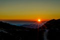 Beautiful Sunset over the Mountains of Crete Island, Greece. Panoramic View from the Mountain Top. Horizon with Golden Sun Rays Royalty Free Stock Photo