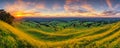 beautiful sunset over mountains and hills of pastures and farms in villages. Amazing colorful sky and incredible landscape to Royalty Free Stock Photo