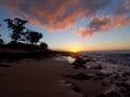 Beautiful Sunset over the ocean and beach with waves moving to shore Royalty Free Stock Photo