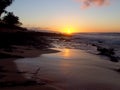 Beautiful Sunset over the ocean and beach with waves moving to shore Royalty Free Stock Photo