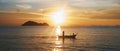 Beautiful sunset over the ocean. Boat on the water Royalty Free Stock Photo