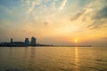 Beautiful sunset over the ocean at Sriracha town in Chonburi, Thailand showing colorful sky and dramatic clouds Royalty Free Stock Photo