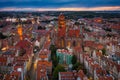 Beautiful sunset over the old town of Gdansk with City Hall and St. Mary Basilica, Poland Royalty Free Stock Photo