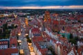 Beautiful sunset over the old town of Gdansk with City Hall and St. Mary Basilica, Poland Royalty Free Stock Photo