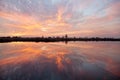 Red and orange ouds reflected in the river at sunset. Ukraine. Royalty Free Stock Photo