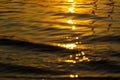 Beautiful sunset over the river. The solar path on the surface of the water. Reflection of the setting sun