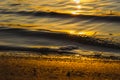 Beautiful sunset over the river. The solar path on the water surface. Reflection of the setting sun. Selective focus Royalty Free Stock Photo