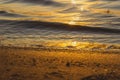 Beautiful sunset over the river. The solar path on the water surface. Reflection of the setting sun. Selective focus Royalty Free Stock Photo