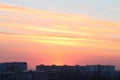 Beautiful sunset over roofs of residential buildings