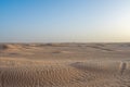 Beautiful sunset over Sahara desert in Douz, Tunisia. Sand and dunes against sky Royalty Free Stock Photo