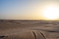 Beautiful sunset over Sahara desert in Douz, Tunisia. Sand and dunes against sky Royalty Free Stock Photo