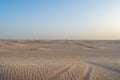 Beautiful sunset over Sahara desert in Douz, Tunisia. Sand and dunes against sky Royalty Free Stock Photo