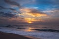 Sunset on the beach, beautiful sea and colorful sky with flock of seagulls Royalty Free Stock Photo