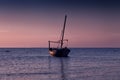 Beautiful sunset over the sea. A small fishing boat. Royalty Free Stock Photo