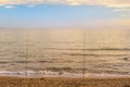 Beautiful sunset over sea and two rods Royalty Free Stock Photo