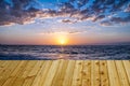 Beautiful sunset over the sea with wooden terrace. Nature composition. can be used for display or montage your products Royalty Free Stock Photo