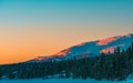 Beautiful sunset over a snowy forest Royalty Free Stock Photo