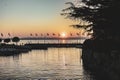 Beautiful sunset over the stunning Garda Lake in Italy, with the sun reflecting on the calm water