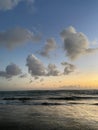 Beautiful sunset over the tropical sea. Romantic sunset walk. Mysterious clouds