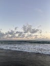 Beautiful sunset over the tropical sea. Romantic sunset walk. Mysterious clouds