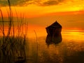 Beautiful sunset over water and silhouette of fishing boat Royalty Free Stock Photo